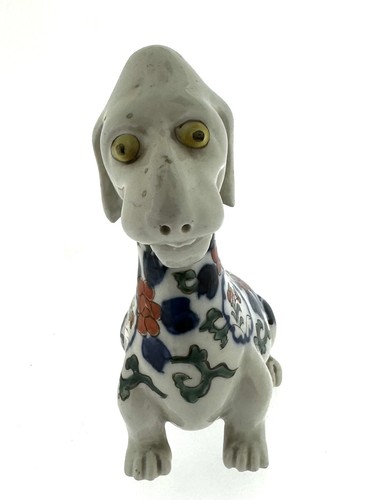 Antica statuina cane comico