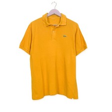 Polo Lacoste gialla scura a