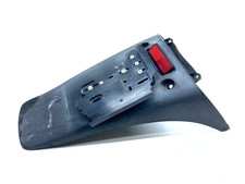 PARAFANGO PORTATARGA POSTERIORE HONDA CHIOCCIOLA 125-150 2000-2006 ORIGINALE