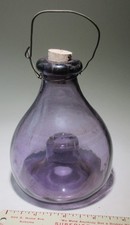 Vintage purple glass fly trap with wire and cork bubble glass