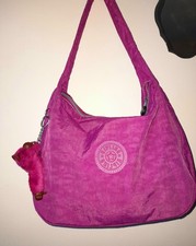 Borsa a tracolla Kipling rosa scuro con scimmia Belinda.