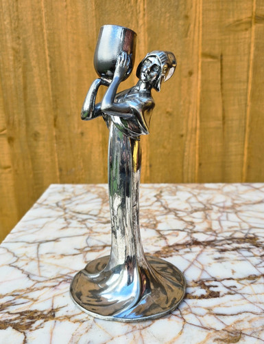 Antico candelabro statuina