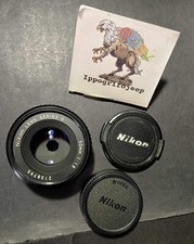 Obiettivo Nikon 50 mm f 1.8 serie E Pancake manual focus fotografia foto tappi