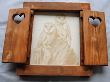 Finestra in legno con scuri