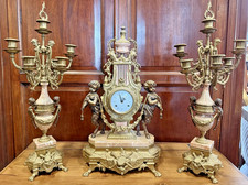 Trittico,orologio e candelabri