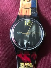 Orologio da polso SWATCH Gent L'UOMO CON LA PISTOLA DORATA (GB210)-J.Bond 007-Speciale