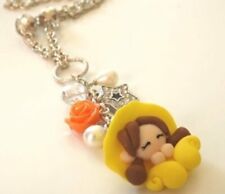 Collana lunga con folletta gialla in fimo,rosa in resina,ciondolo stella con str