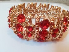 BRACCIALE VINTAGE COCKTAIL GRANDE COLOR ORO CON PIETRE ROSSE ELASTICO 