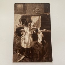 BAMBINA CON CANE AL PIANOFORTE