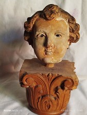 testa di putto in legno occhi