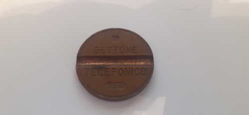 Gettone telefonico 7711 - gettone,