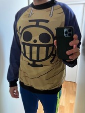 Maglia One Piece Trafalgar Law, gialla e blu. Stemma Trafalgar Law