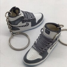 Coppia di portachiavi sneaker