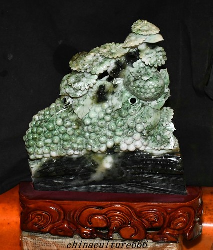 Statua fiore melograno uva