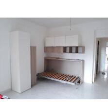 Letto singolo a scomparsa salva spazio color legno 