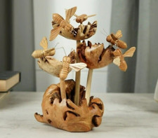 Scultura in legno api su