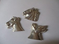 Silver brooches horse, wolf