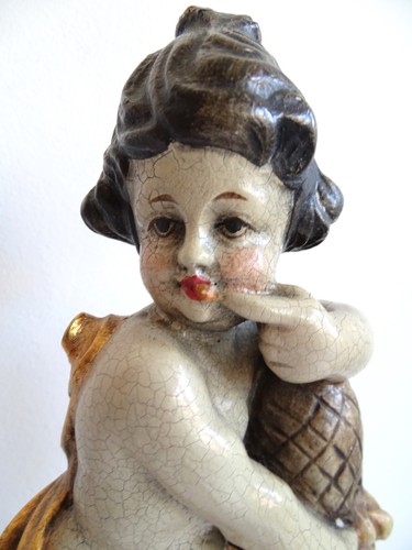 Antico angelo putto porta