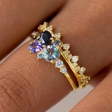 Anello oro blu viola zirconi