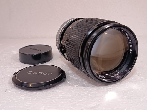 Canon 135 f 2 - s.c.,