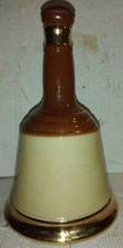 bottiglia vintage di bell's scotch whisky a forma di campana filettata  in oro