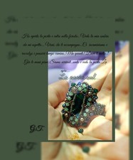 Anello fatto con cristalli e perline varie.Idea regalo.