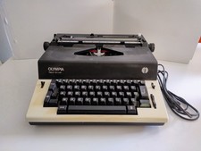 Olympia REPORT DE LUXE