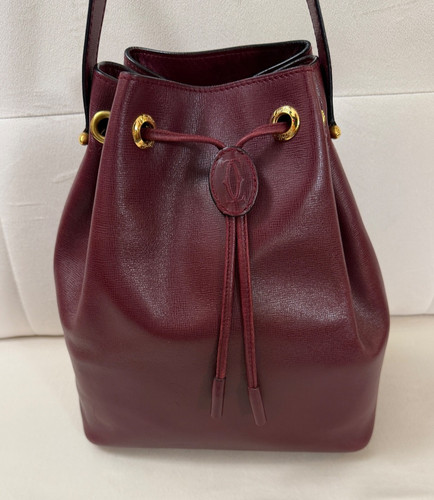 Cartier must bucket - de,