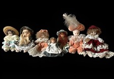 Set unico con n. 7 Bambole Vintage di Porcellana