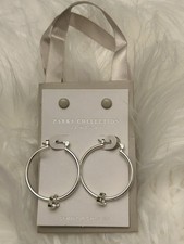 Orecchini a cerchio pendenti