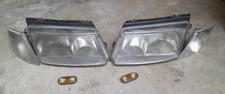 Coppia fari ant. Dx/Sx completi di fanalini + 2 laterali passat B5 anno 97/00 