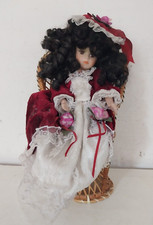 Bambola porcellana anni 80/90 con sedia in vimini