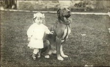 Little Girl Huge Family Dog