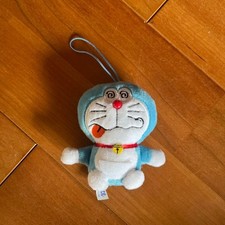 Peluche Doraemon con cinturino