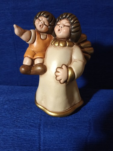 Angelo con bimbo thun - angelo,