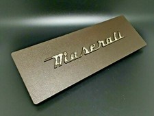 MASERATI BITURBO COVER PLASTICA MODANATURA AUTO RADIO LOGO BADGE STEMMA FREGIO