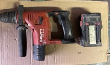 Trapano a percussione rotativo