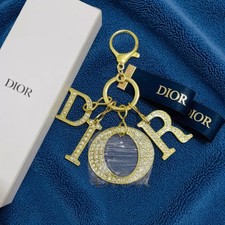 Charm llavero Baby Dior dorado
