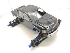 Upgraded Traxxas Revo 3.3 1/8 Monster Truck Roller Slider Chassis w/ Body Used