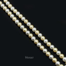 Filo di perle in oro chiaro