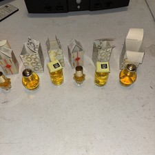Six Avon perfume bottles in