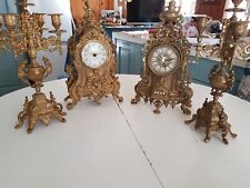 orologi e candelabri in ottone