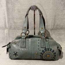 Rara borsa a tracolla Coach Mia in pelle con borchie