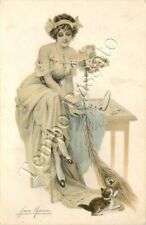 Cucciolo di gatto che gioca con piuma di pavone - 1918