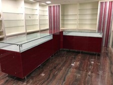 Bancone Attivita' Commerciale non alimentare, con vano in vetro e cassettoni.