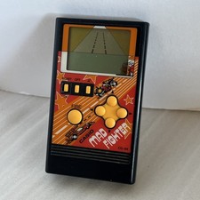 Vintage Casio CG-84 Mad Fighter Handheld LCD Game 1984