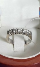 Anello a fascia in oro bianco con 5 brillanti ct 0,50