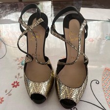 Christian Louboutin oro nero