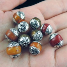 10 piccole perline tibetane nepalesi in resina ambra gialla e rossa, circa...