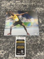 Usain Bolt foto firmata